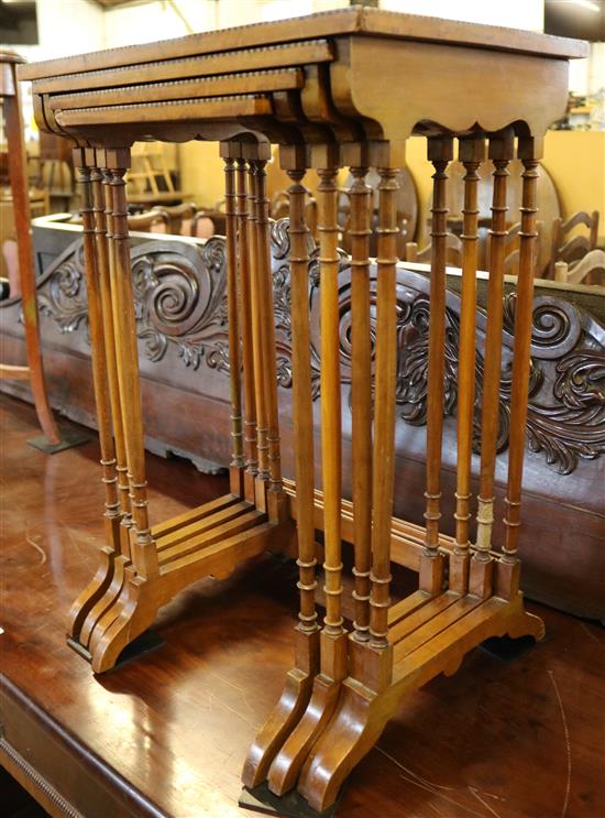 Nest of four Edwardian period satinwood tables